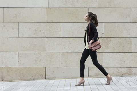Side-view-of-a-Caucasian-Businesswoman-walking