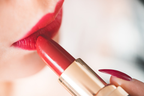 young-woman-applying-red-lipstick-picjumbo-com