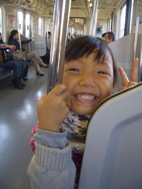 電車で