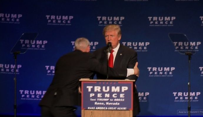 161105211328-01-trump-rushed-off-stage-1105-exlarge-169