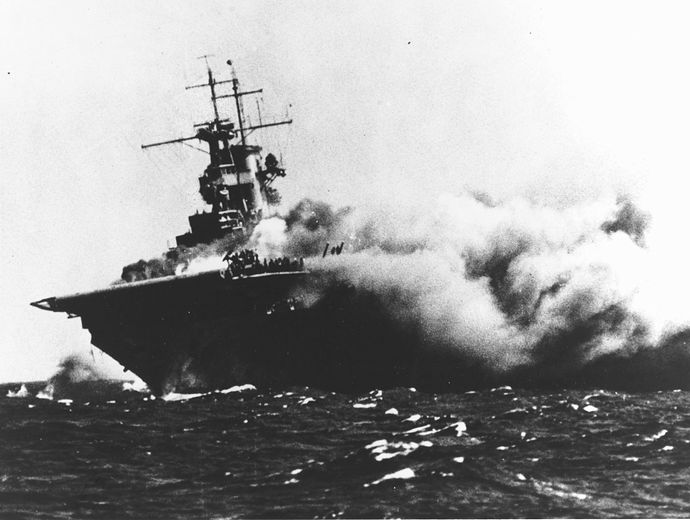 1280px-USS_Wasp_(CV-7)_burning_on_15_September_1942_(80-G-16331)