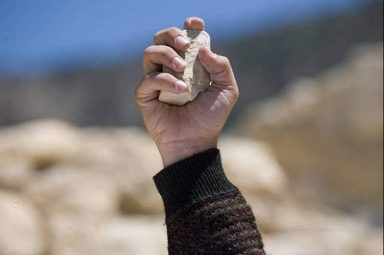 hand-with-stone