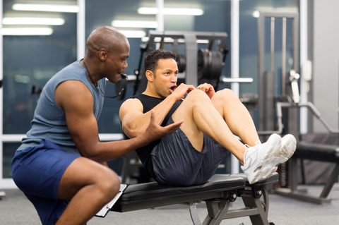 middle-aged-man-with-personal-trainer