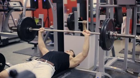 depositphotos_93898522-stock-video-man-doing-bench-press-workout