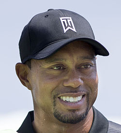 Tiger_Woods_with_a_fan_2014_cr