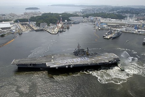 Description: Sailors spell out Sayonara on the flight deck of the aircraft carrier USS Kitty Hawk (CV 63) as the ship departs Yokosuka, Japan usnavy2