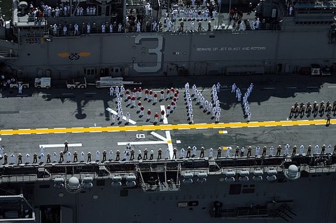 Description: Sailors aboard the amphibious assault ship USS Kearsarge (LHD 3) spell out usnavy9