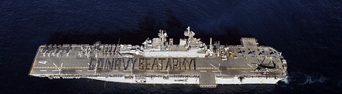 Description: Sailors and Marines aboard the amphibious assault ship USS Boxer (LHD 4) spell out Go Navy Beat Army! on the flight deck to cheer on the midshipmen in the upcoming 109th Army-Navy college football game. usnavy5