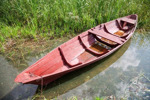 depositphotos_83035596-stock-photo-old-red-wooden-boat-at