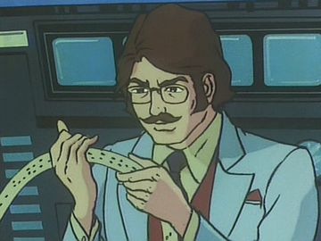 コンピューターの吐き出した紙テープを読む南部博士(ガッチャマン)。昔のマンガではよくあったシーンで、お茶の水博士も得意だったようです。