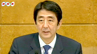 安部会見