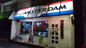 7077