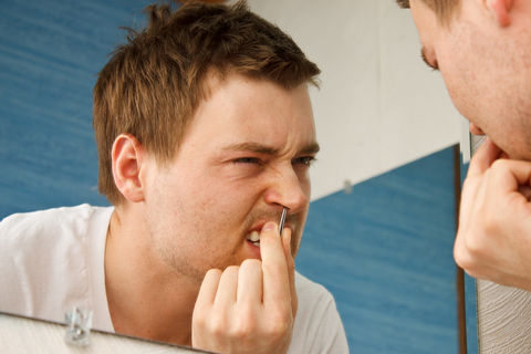 Man-Plucking-Nose-Hair
