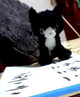 猫に