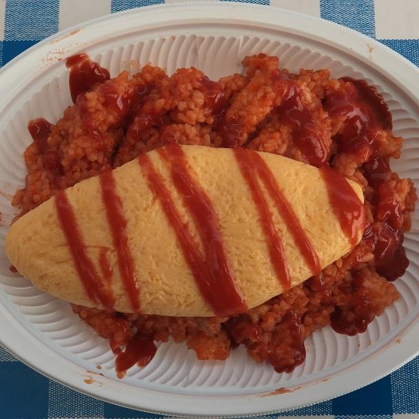 Omelette avec la personne de riz de Paris