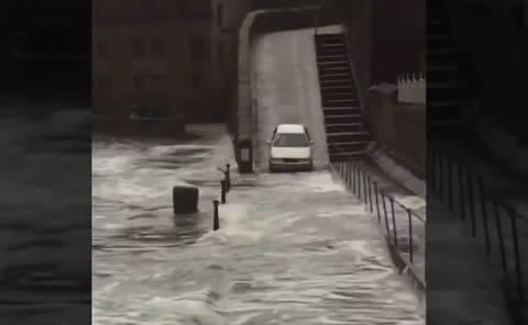 Idiot motorist caught driving through floodwater