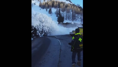 Avalanche Down Hill Cascades onto Road