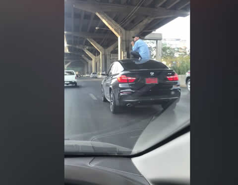 BMW Driver Sits On Car Roof After Crash