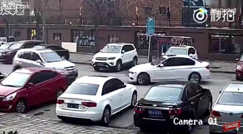White BMW hits black Chevy out of parking space