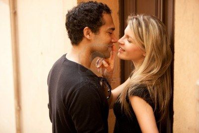 7651439-a-couple-flirting-in-an-outdoor-european-urban-setting