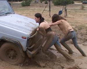http://www.madmanmovies.com/images/gross/car_stuck_girls_ridingboots_mud_024-new.jpg