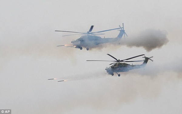 447317FE00000578-4898492-Russian_military_helicopters_fire_