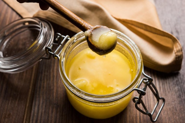 ghee-butter-in-glass-jar-with-wooden-spoon