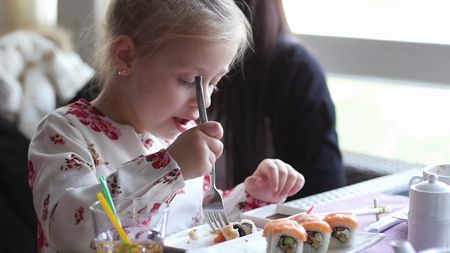 little-girl-eats-sushi-with-a-fork_sn732jkgl_thumbnail-full01