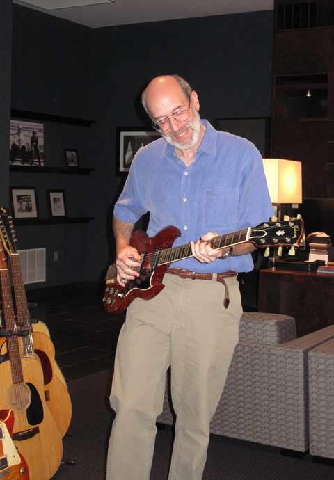 Gary Graff holding 227666 guitar