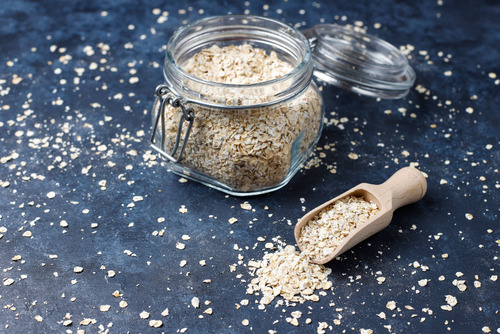 oat-flakes-in-glass-jar-on-dark-table