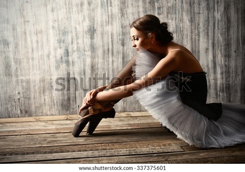 professional-ballet-dancer-resting-after-600w-337375601