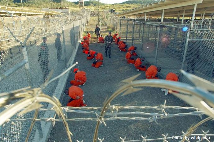Guantanamo_captives_wait_during_processing_on_January_11th,_2002