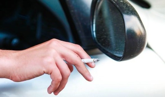 10072645_cigarette-out-car-window-min