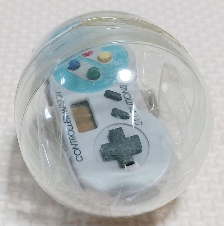 パチ物 スーパーファミコン コントローラーウォッチ ガチャガチャ 時計 トレジャーハンティン部 部長のブログ