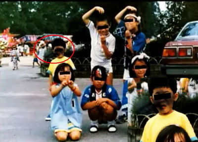 顔が潰れている少年