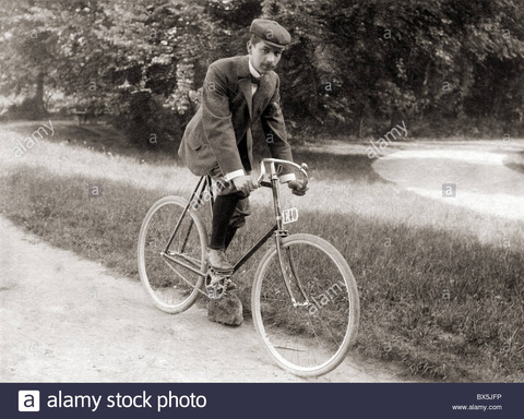 bicycle-young-man-riding-a-bike-circa-1900