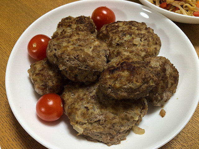 Hamburgers and small tomatoes