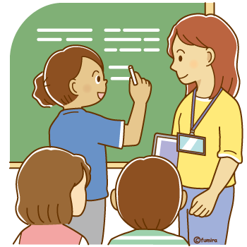 授業中に黒板の前で答えを書いている外国人の女の子と先生350