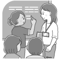 授業中に黒板の前で答えを書いている外国人の女の子と先生モノクロ