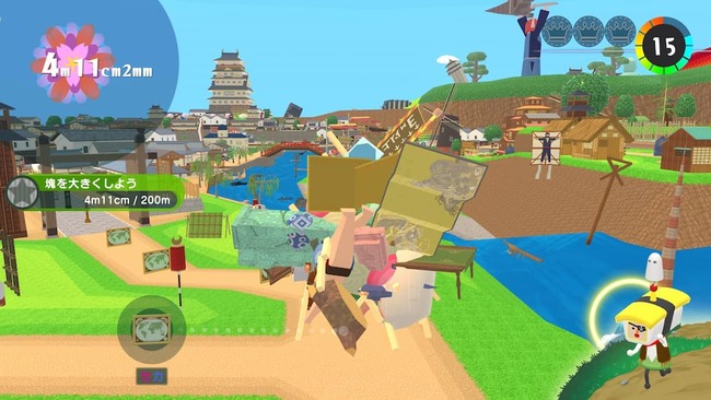 和風の城や忍者などがいるステージを塊を転がしながら大きくしていってる場面