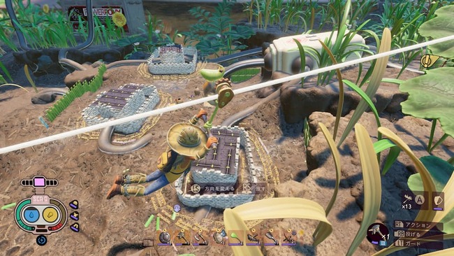 ジップラインを使い高所を移動中に眼下に設置された防衛拠点の様子を眺めているマックス