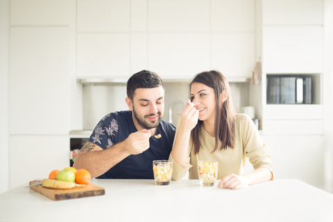 bigstock-Young-lovely-couple-eating-fru-118963937