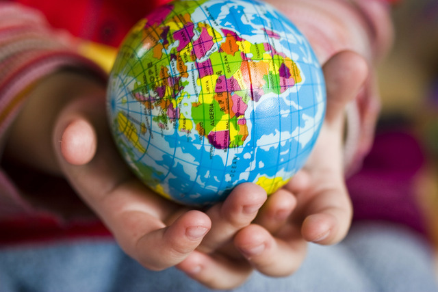 hands-holding-small-globe-of-earth