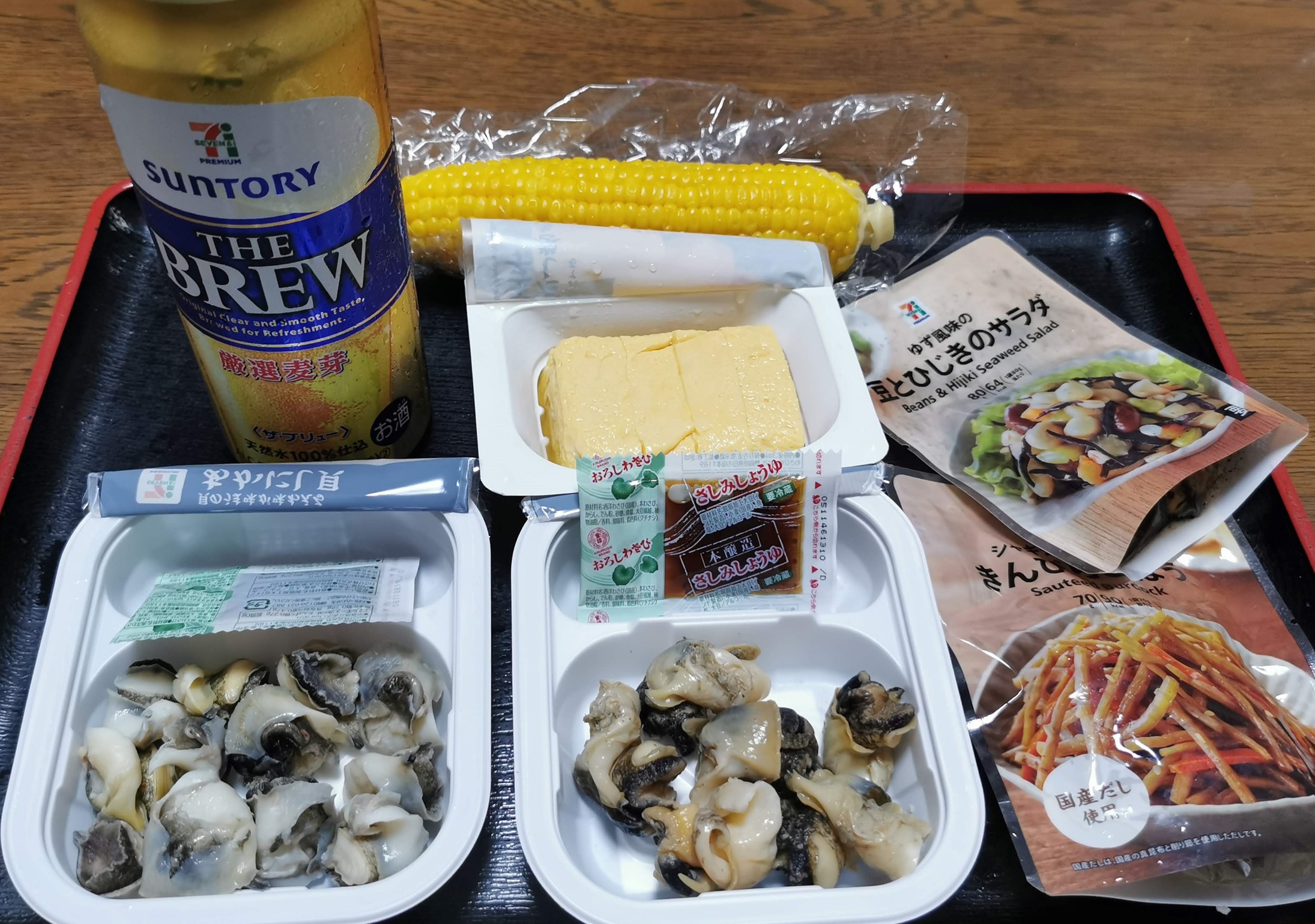 セブンイレブンのつぶ貝とアカニシ貝などの惣菜で飲む : 函館の