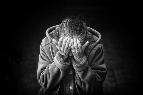 grayscale-photography-of-person-covering-face