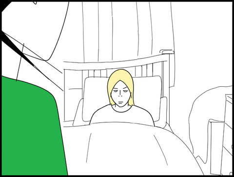 布団の中の旦那を見つめる