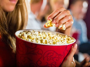 Woman-container-popcorn-cinema-movie-theater