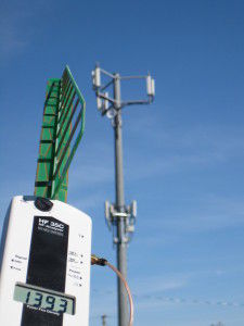 EMF-meter-and-cell-tower-225x300