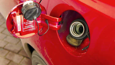 refuelling-fuel-tank-red-car-closeup-picture-id652592152