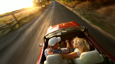 stock-footage-couple-in-convertible-car-driving